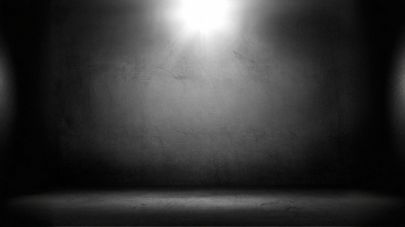 Black wall with dramatic lighting